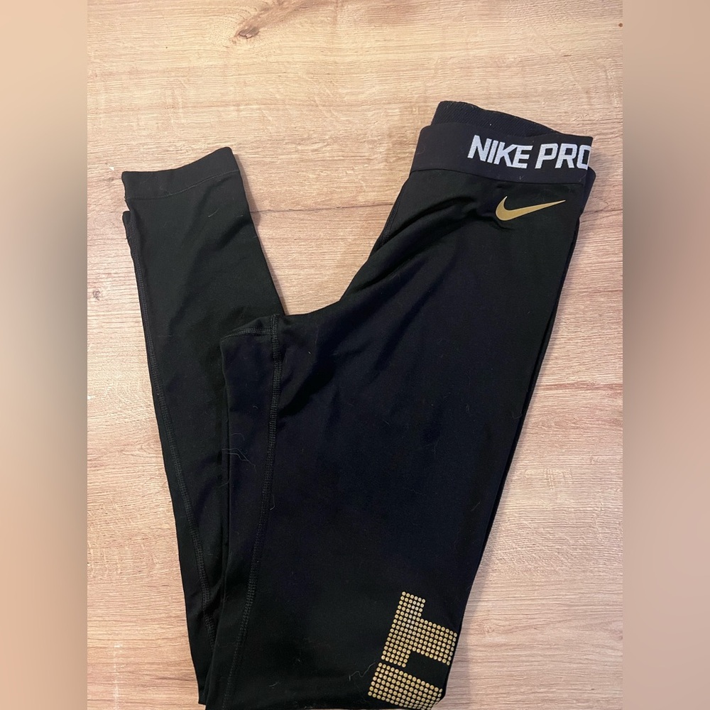 Nike Pro Dri-fit Women’s Black and Gold Leggings